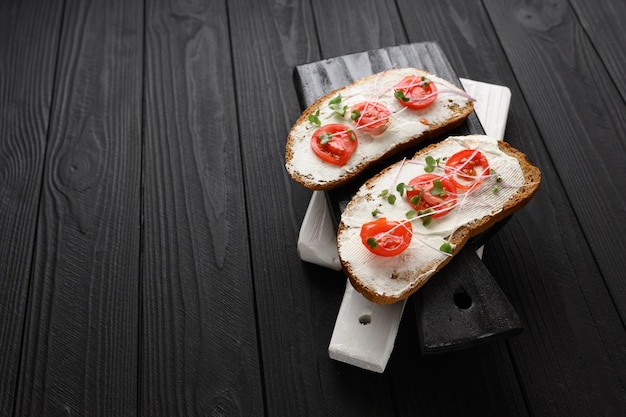 Toasts with microgreens on the table Healthy food vegan food and dieting concept