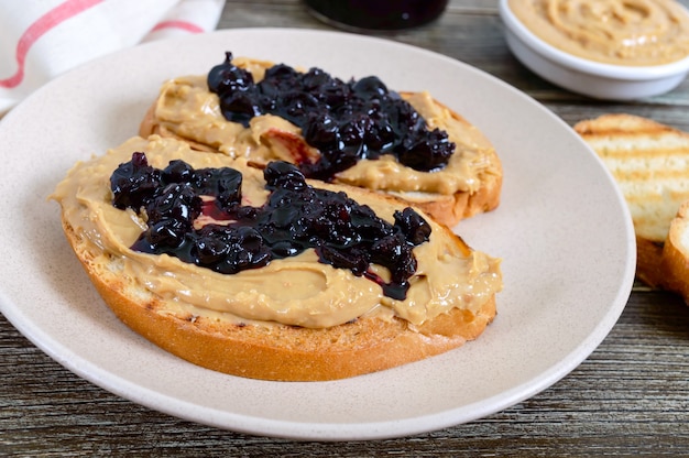 Toasts with peanut butter and berry jam