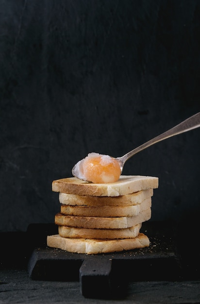 Toasts with yolk over black