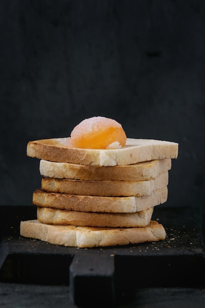 Toasts with yolk over black