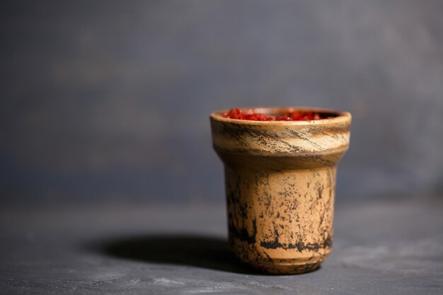 Tobacco for hookah in a clay bowl