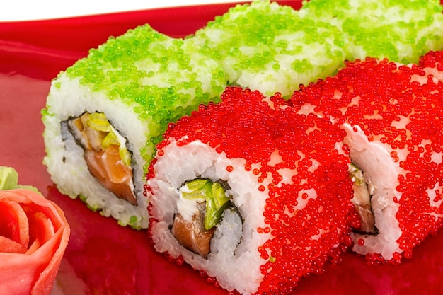 Tobiko Spicy Maki Sushi Hot Roll with various type of Tobiko flying fish roe outside and salmon inside