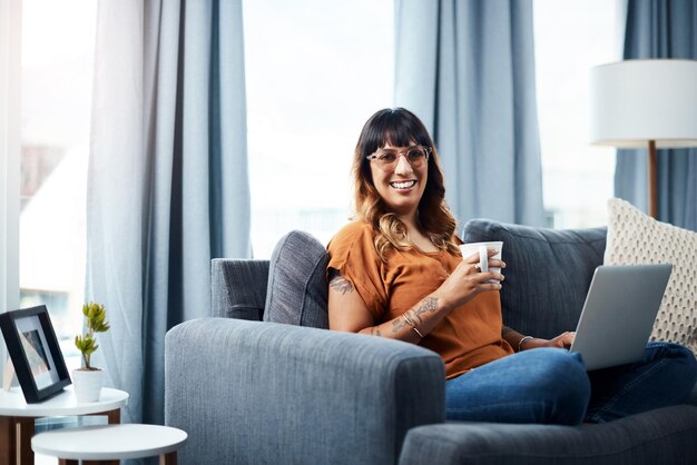 Today Ill catch up with my favorite shows Shot of a young woman using her laptop while relaxing at home