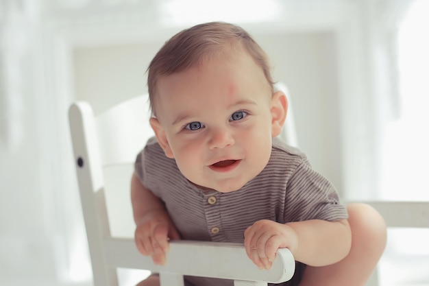 toddler child in a bright studio / little boy infant beautiful healthy child