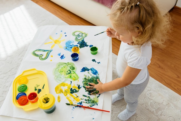 Toddler child painting at home creative free time