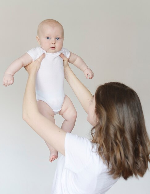 toddler in mom's arms