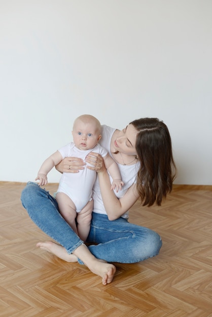 toddler in mom's arms