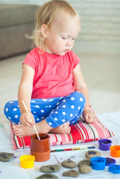 toddler paints with gouache