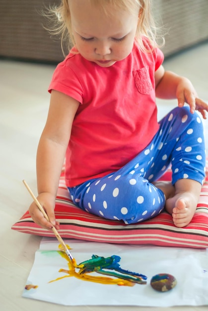 toddler paints with gouache