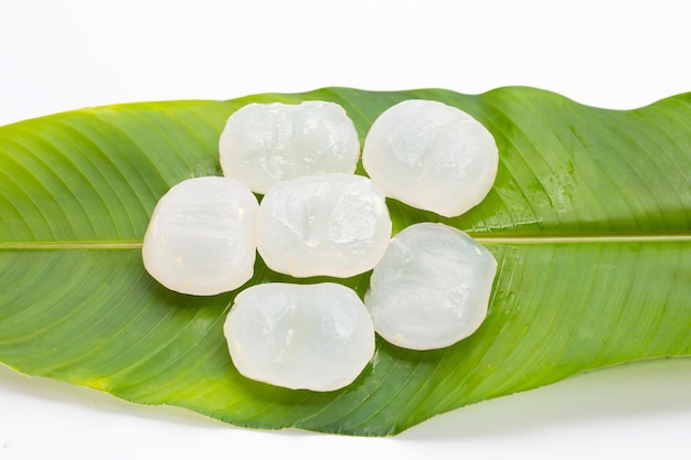 Toddy palm on green leaves on white background.