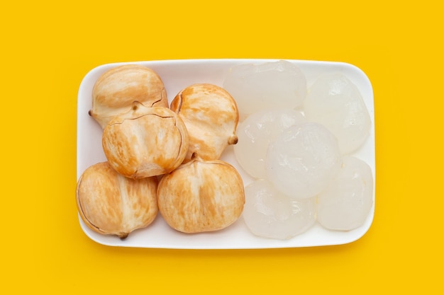 Toddy palm in white plate on yellow background.