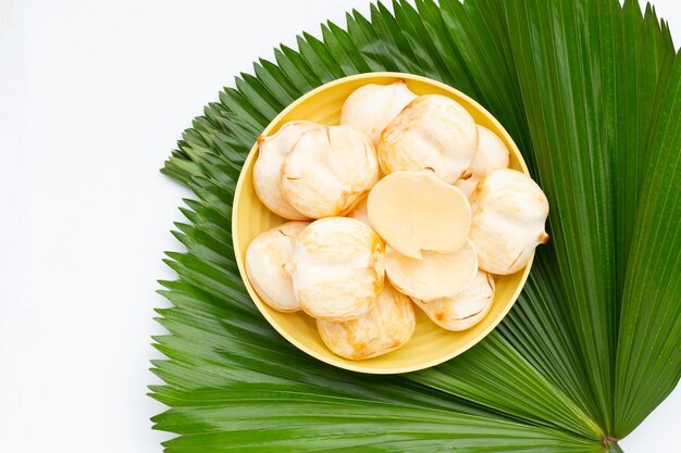 Toddy palm in yellow plate on green leaf