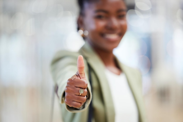 together well take over the world. shot of a young woman giving the thumbs up while shopping.