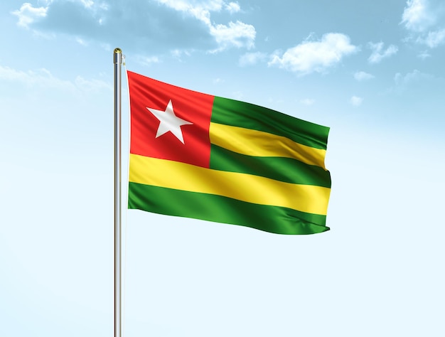 Togo national flag waving in blue sky with clouds Togo flag 3D illustration