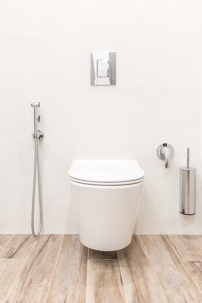 Toilet bowl in modern white style bathroom