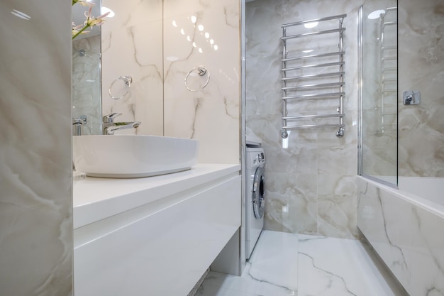 Toilet and detail of a corner shower cabin with wall mount shower attachment