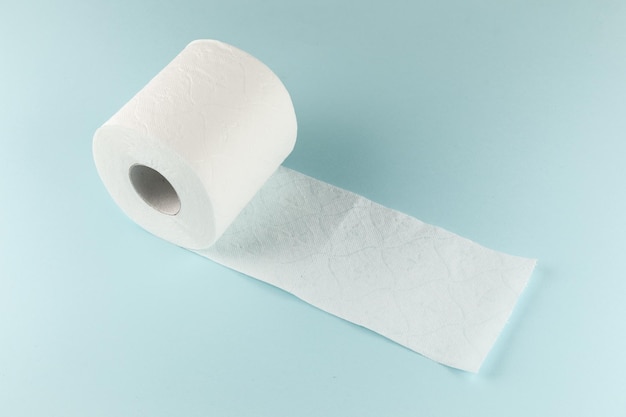 Toilet paper on a bright blue background