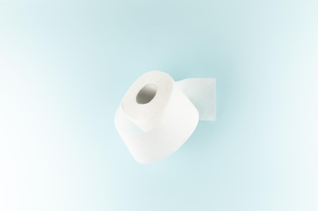 Toilet paper on a bright blue background