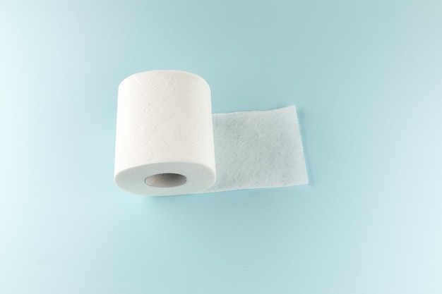 Toilet paper on a bright blue background