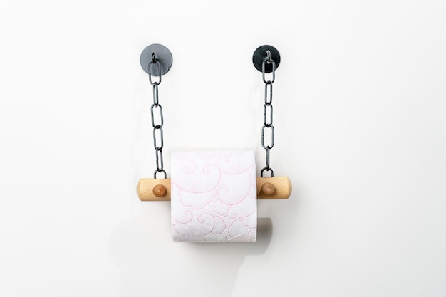 Photo toilet paper holder on wall