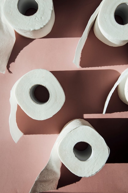 toilet paper on a pink background