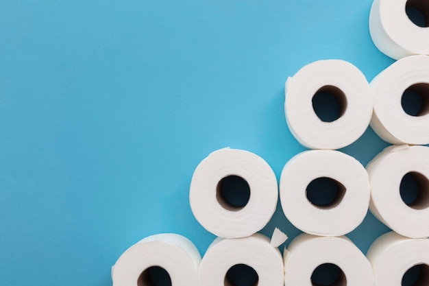 Toilet paper roll background overhead flat lay