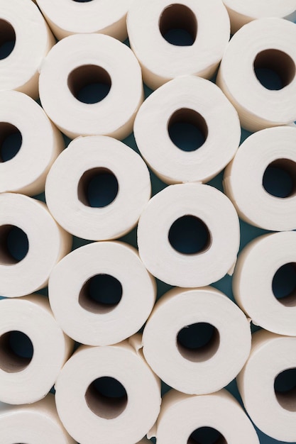 Toilet paper roll background overhead flat lay