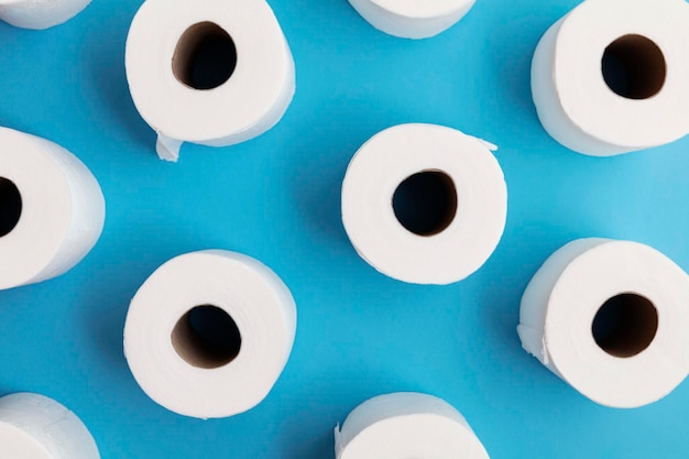 Toilet paper roll background overhead flat lay