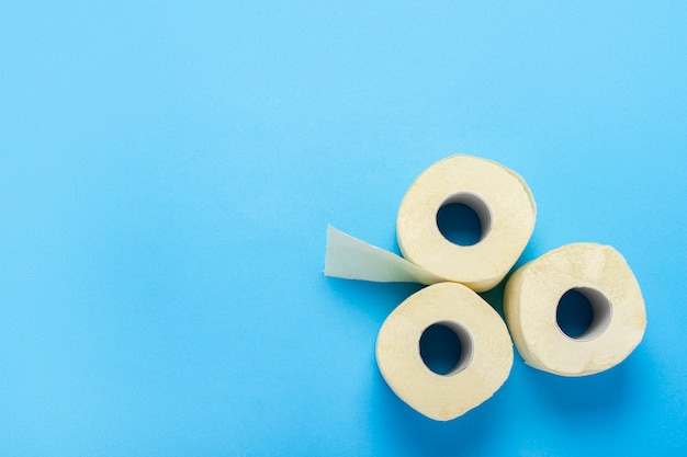 Toilet paper rolls on a blue