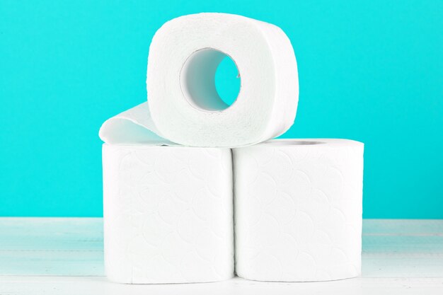 Toilet paper rolls on turquoise bright 