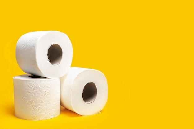 Toilet paper on a yellow background.