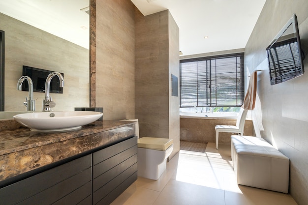 Toilet room with sink ,bathtub and toilet bowl