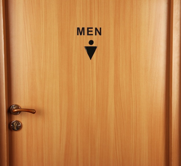 Toilet sign on wooden door