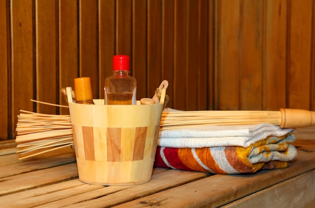 Toiletries and towels on shelf in sauna