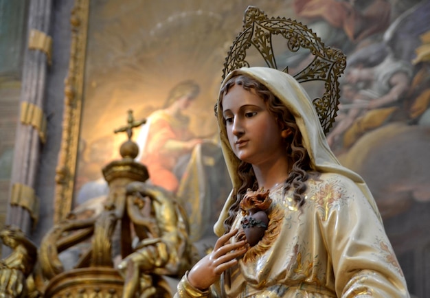 TOLEDO, Spain - 27 September 2015: Image of a virgin pointing to the heart displayed in a church.