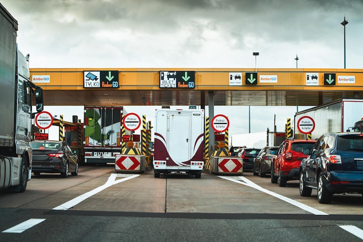 Photo toll plaza traffic vehicles queue at payment booth