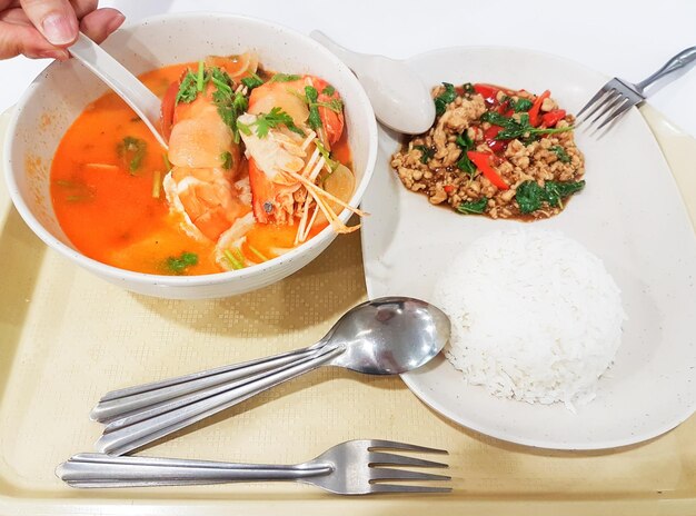 Tom yum prawn soup basil chicken with rice