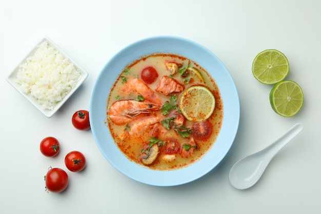 Tom yum soup and ingredients on white background