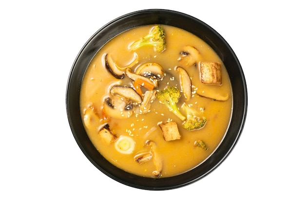 Tom yum vegetarian soup in a black dish on a white background a Thai dish