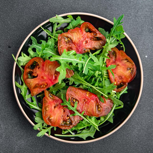 tomato arugula salad healthy meal food snack on the table copy space food background rustic top