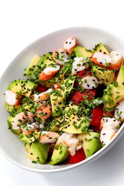 Tomato avocado and prawns in a bowl