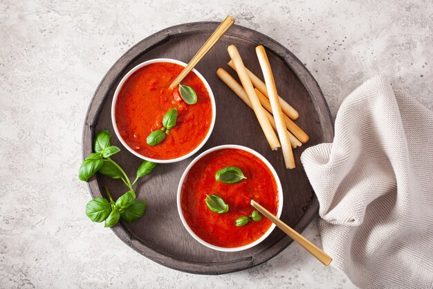 Tomato and bell pepper vegetarian soup on green