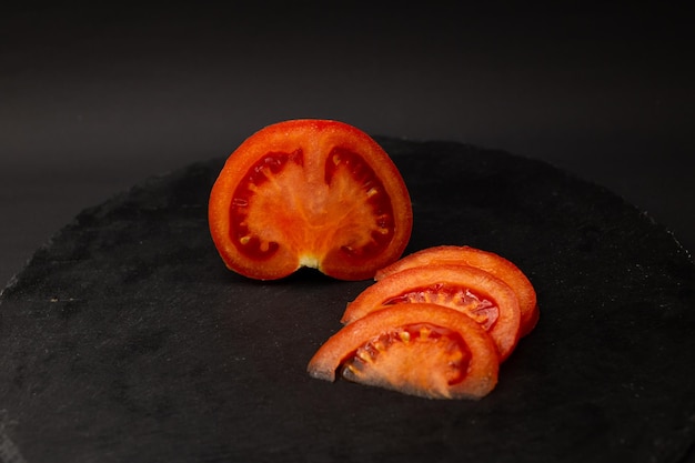 Tomato on a black background