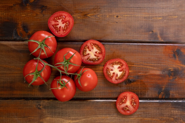 Tomato on a brown wooden table