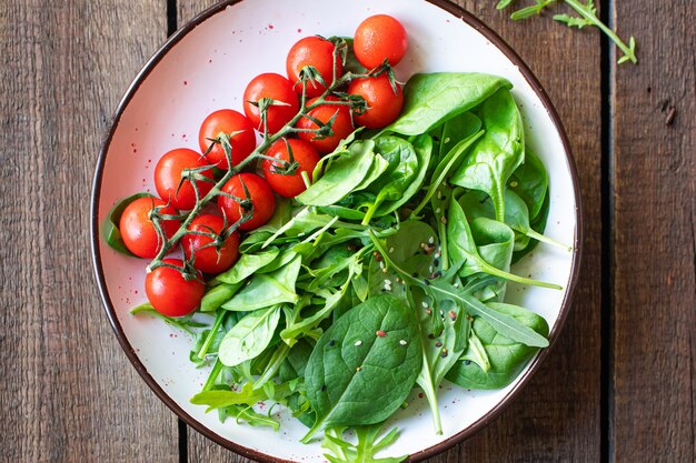 Tomato cherry salad green leaves fresh mix greens spinach arugula lettuce ingredient healthy food