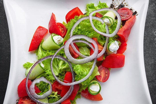 Tomato cherry salad with basil black pepper and onion