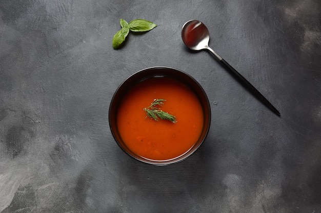 Tomato cream soup on a bowl