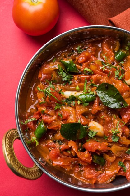 Tomato Curry OR Sabzi also known as Sabji or Chutney served in bowl,  popular indian vegetable menu for main course. selective focus