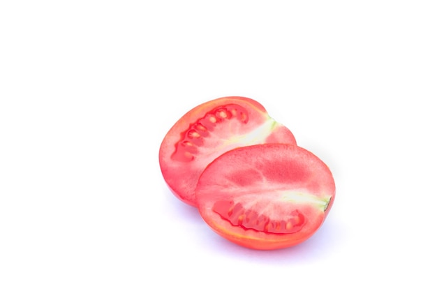 Tomato cut in half on isolated white background.