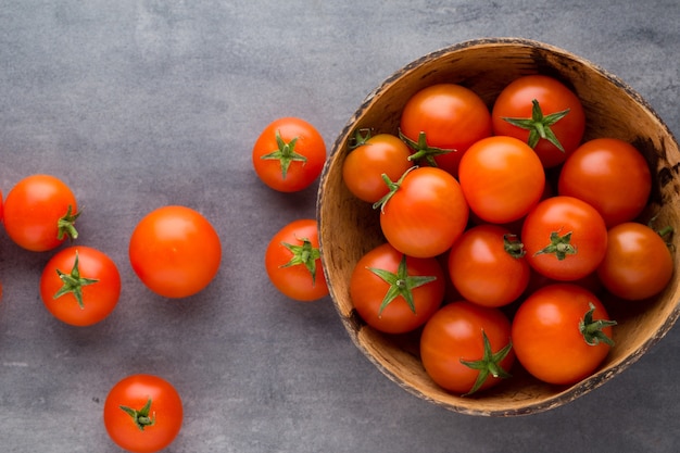 Tomato on the gray table.